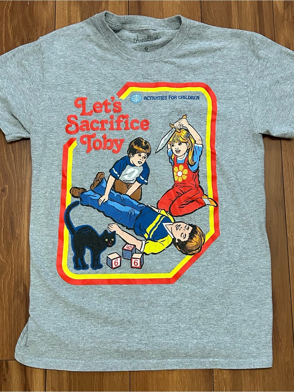 Steven Rhodes Let's Sacrifice Toby graphic t-shirt Size Small Unisex in gray.
